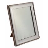 A silver rectangular photograph frame by A. & J  A silver rectangular photograph frame by A.  &