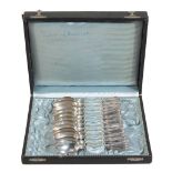 A cased set of twelve French silver coloured tea spoons by Claude Doutre...  A cased set of twelve