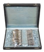 A cased set of twelve French silver coloured tea spoons by Claude Doutre...  A cased set of twelve