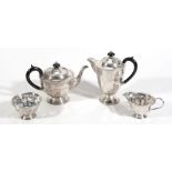 A silver circular facetted four piece tea service by Viners, Sheffield 1932  A silver circular
