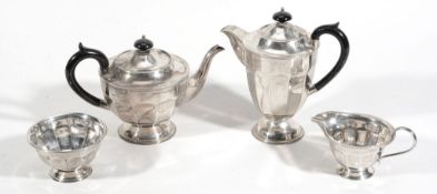 A silver circular facetted four piece tea service by Viners, Sheffield 1932  A silver circular