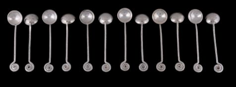 A set of twelve South African Arts and Crafts silver coloured tea spoons by...  A set of twelve