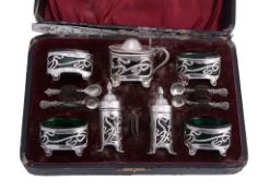 An Art Nouveau silver seven piece cruet set by William Devenport  An Art Nouveau silver seven