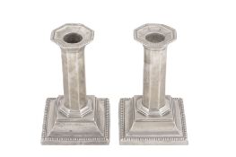 A pair of silver short candlesticks by William Hutton & Sons Ltd  A pair of silver short