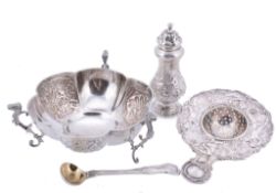 A Victorian silver embossed baluster pepperette by Daniel & Charles Houle  A Victorian silver