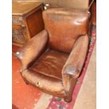 An early 20th Century leather armchair