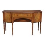 A Regency mahogany & strung inlaid breakfront sideboard, circa 1815, the central drawer and recessed