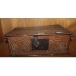 A 17th century oak Bible box with iron lockplate and carved front, 41cm wide