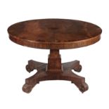 A George IV mahogany breakfast table, circa 1825, with a crossbanded circular top on square