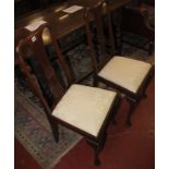 Dining chairs a set of six with shell detail to the backs.