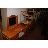 A pine dressing table, stool, toilet mirror, chest of drawers and two bamboo bedside tables and a