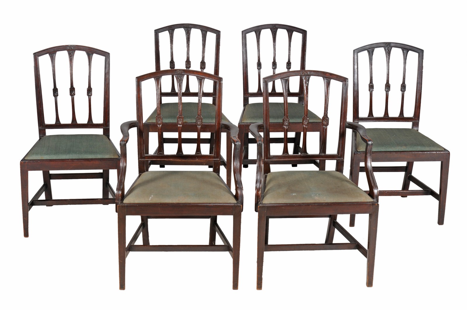 A set of six late George III mahogany dining chairs, circa 1800, to include two carvers, each with