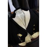 A Naval dress uniform and a bicorn hat