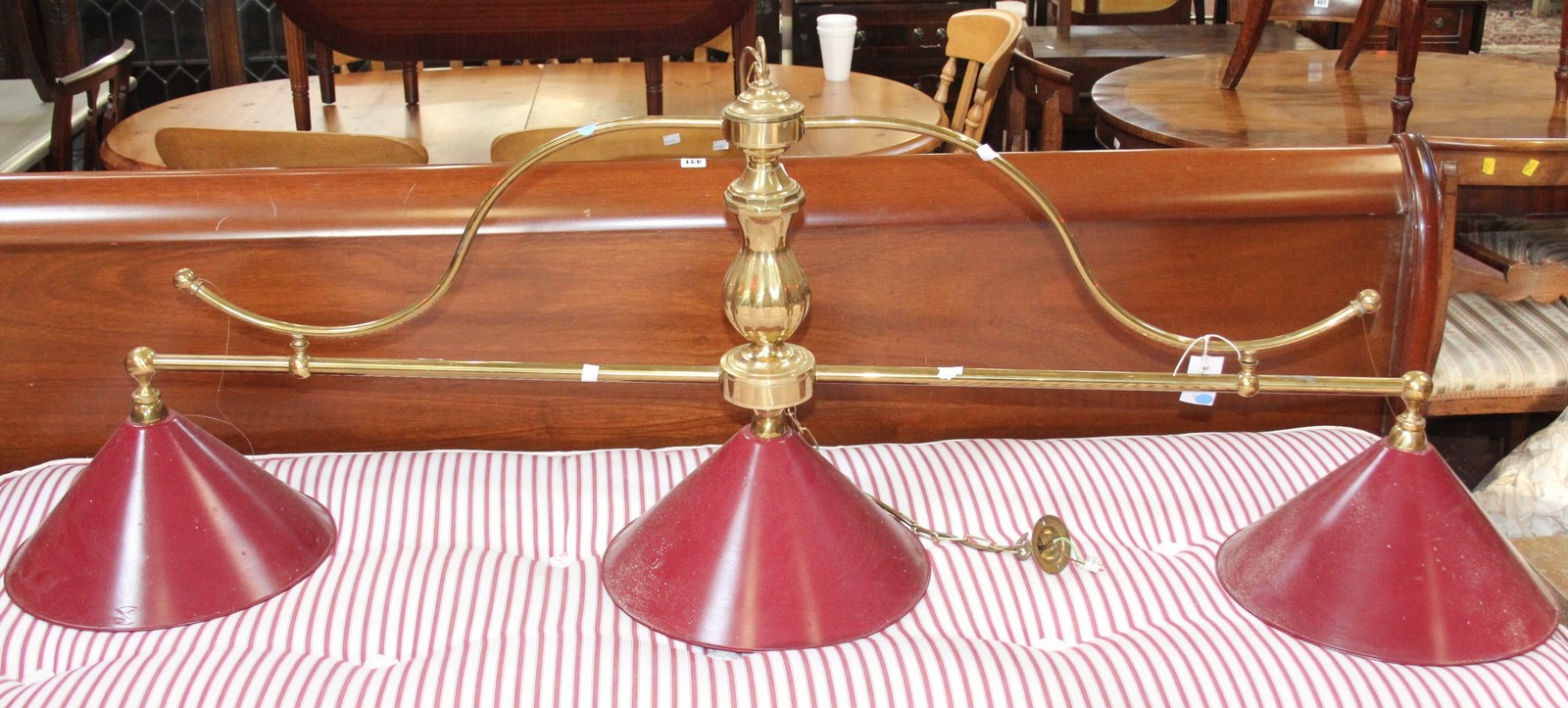 A brass snooker table light with a turned support and three fittings 140cm length Best Bid