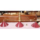 A brass snooker table light with a turned support and three fittings 140cm length Best Bid