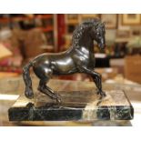 A 20th century bronze model of a horse, on a veined marble rectangular base, 14.5cm high