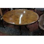 *A Victorian burr walnut oval table on turned column and floral carved legs 135cm wideBest Bid