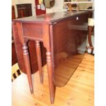 A Regency style mahogany gateleg table and six matching chairs