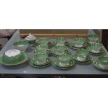 A T. Goode & Co part tea-service in green with gilt borders (10 cups with saucers).Best Bid