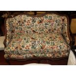 A French beechwood and floral upholstered two seat sofa 133cm length