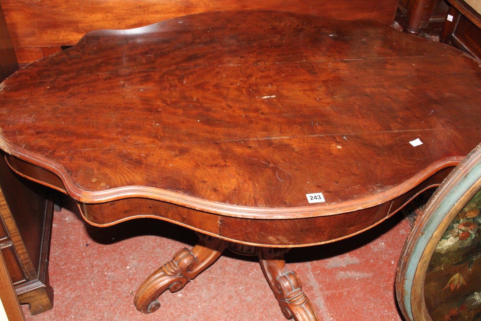 *A Victorian centre table with a frieze drawer on carved stem and splayed legs 127cm wide