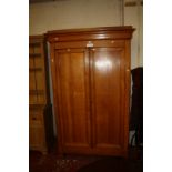 A 19th Century Continental oak cupboard 211cm high, 132cm wide.