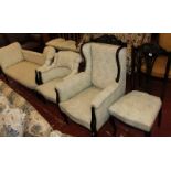 An Edwardian upholstered salon suite, chaise longue, four side chaise armchair and tub chair.