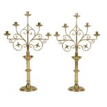 A pair of brass five light candelabra in Gothic style, early 20th century  A pair of brass five