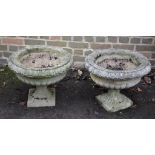 A pair of reconstituted stone garden urns, 20th century, 44cm high  A pair of reconstituted stone