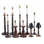 A selection of carved wood table lamps in the eighteenth century style  A selection of carved wood