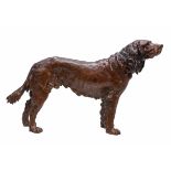 A patinated bronze model of a setter, late 19th/ early 20th century, cast standing with head