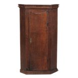 A George III oak hanging corner cupboard , circa 1770  A George III oak hanging corner cupboard  ,