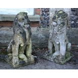 A pair of reconstituted stone models of seated lions, late 19th/ 20th century, on integral