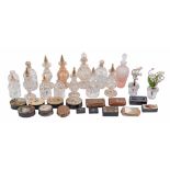A collection of assorted glass scent bottles and stoppers  A collection of assorted glass scent