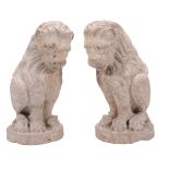 A pair of Italian sculpted Breccia stone models of seated lions, 19th century  A pair of Italian