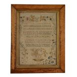 A George III embroidered sampler worked by Esther Sarjant , dated 1802, the verse within a floral