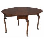 A George II mahogany drop leaf dining table , circa 1740  A George II mahogany drop leaf dining