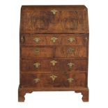 A burr walnut bureau, circa 1740 and later  A burr walnut bureau, circa 1740 and later  , the hinged