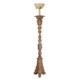 An Italian carved, polychrome and parcel giltwood torchere stand  An Italian carved, polychrome