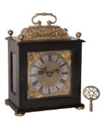 A fine Charles II gilt brass mounted ebony small basket top table clock with pull-quarter repeat