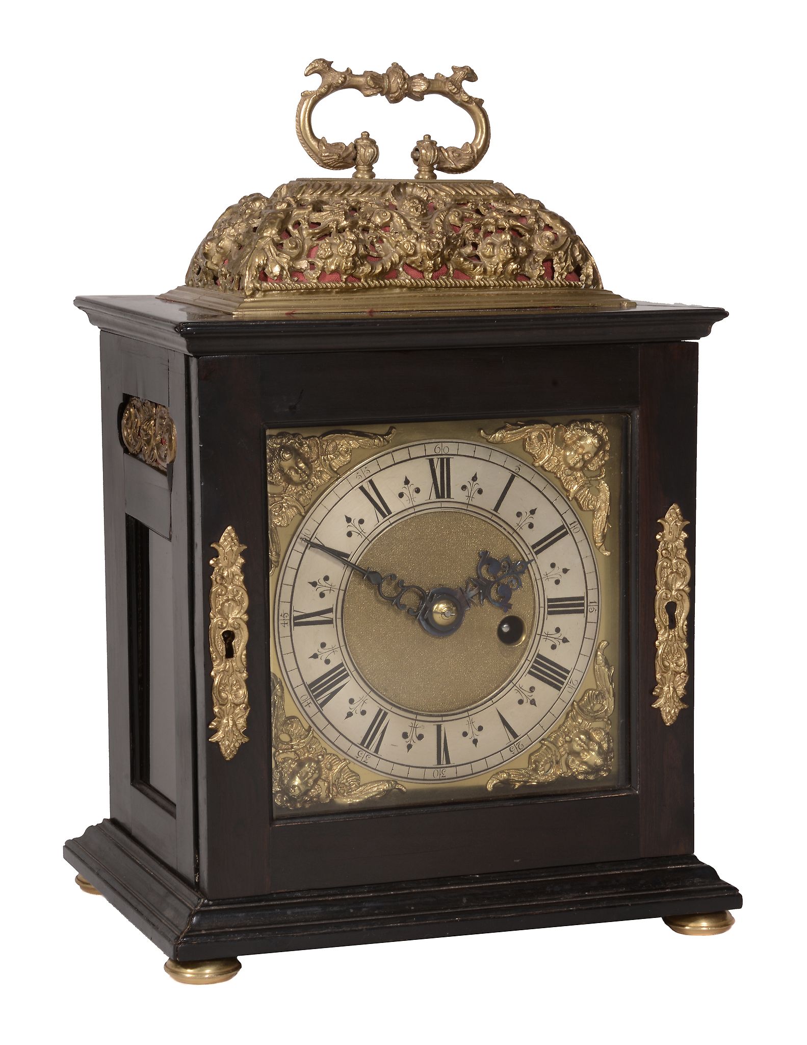 A fine James II gilt brass mounted ebony small basket top table timepiece with silent-pull quarter-