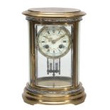 A French champleve enamelled brass oval four glass mantel clock The movement...  A French