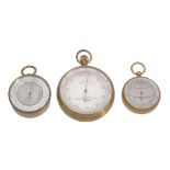 A Victorian gilt brass cased aneroid pocket barometer with altimeter scale...  A Victorian gilt