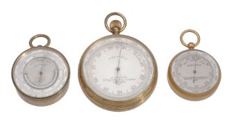 A Victorian gilt brass cased aneroid pocket barometer with altimeter scale...  A Victorian gilt