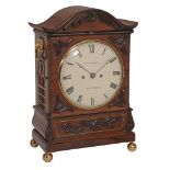 A William IV brass inlaid carved mahogany bracket clock The dial inscribed...  A William IV brass