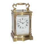 A French lacquered brass bowfronted carriage clock with push-button repeat...  A French lacquered