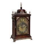 A fine George III brass mounted figured mahogany quarter chiming table clock...  A fine George III