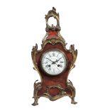 A French Louis XV style gilt brass mounted tortoishell mantel clock Retailed...  A French Louis XV