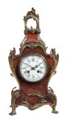 A French Louis XV style gilt brass mounted tortoishell mantel clock Retailed...  A French Louis XV