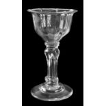 A pedestal stemmed sweetmeat glass, the moulded ogee bowl with everted rim, supported on a